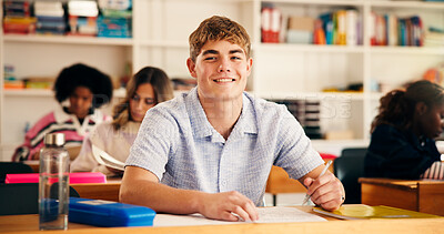 Buy stock photo Portrait, high school and boy in classroom, students and writing tests with assessment. Teenagers, development and knowledge with exam, assignment and learning with education, smile and confident