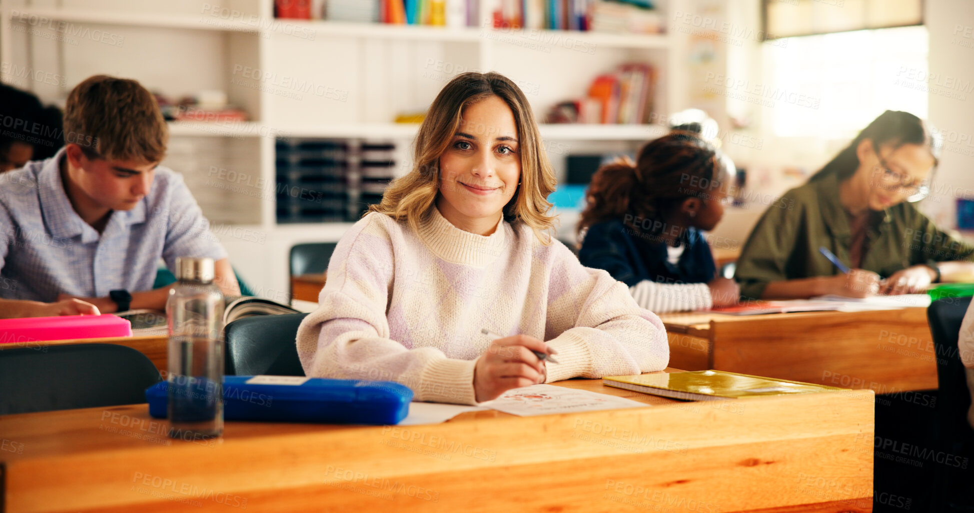 Buy stock photo Portrait, high school and girl in classroom, students and writing tests with education. Teenagers, child development and knowledge with exam, assignment and learning with assessment and confident