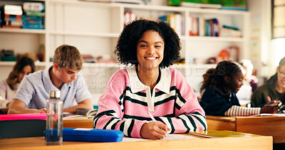 Buy stock photo Learning, classroom and happy teen writing in high school for test, education or academic knowledge. Students, notes and girl study in academy for quiz, scholarship exam and portrait for development