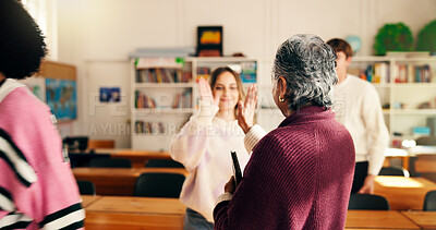 Buy stock photo High five, teacher and student in class with success, support and mentorship in education. Happy, educator and people in school with celebration for achievement, skill and knowledge development.