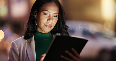 Buy stock photo Woman, tablet and night in city with scroll, direction or booking taxi for commute on business trip. Person, tech and chat in town, contact and notification with social media application in Colombia
