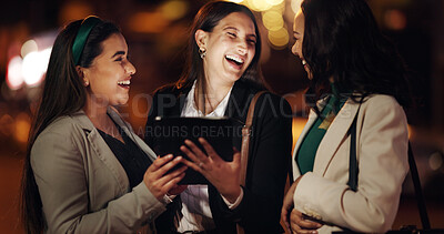 Buy stock photo Funny, night and tablet with business women outdoor together for conversation or planning. App, bokeh and laughing with corporate employee friends working late for collaboration on research deadline
