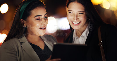 Buy stock photo Collaboration, night and tablet with business women outdoor together for conversation or planning. App, bokeh and discussion with happy corporate employee friends working late for research deadline
