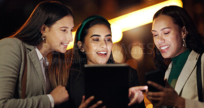 Buy stock photo Tablet, night and reading with business people in city for stock broker report, market research and planning. Bokeh, trading app and investor partnership with women outdoor for overtime and account