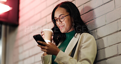 Buy stock photo Business woman, phone and coffee in city, night and smile with contact, meme or chat on web by wall. Person, smartphone and drink in town with notification, mobile app and social media in Mexico
