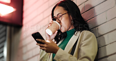 Buy stock photo Woman, phone and coffee in city, night and drink with chat, notification or contact on web by wall. Business person, smartphone and cup in town with scroll, mobile app and social media in Mexico