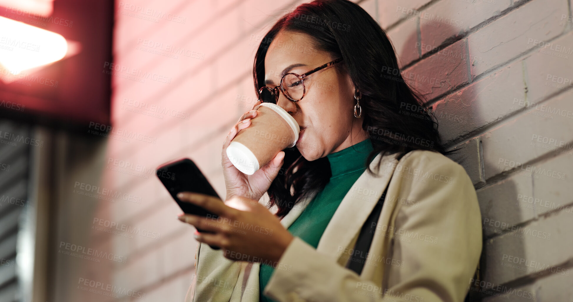 Buy stock photo Woman, phone and coffee in city, night and drink with chat, notification or contact on web by wall. Business person, smartphone and cup in town with scroll, mobile app and social media in Mexico