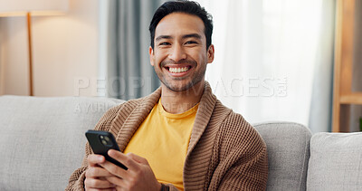 Buy stock photo Phone, portrait and relax with happy man on sofa in living room of home for social media scrolling. App, communication and smile with person typing in apartment for internet search or text message