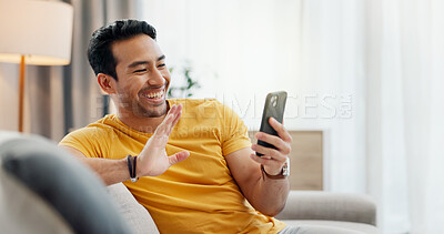 Buy stock photo Wave, video call and man on sofa with phone for connection, social networking and online chat. Happy, hello and person on smartphone for communication, internet and conversation on mobile app in home