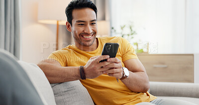 Buy stock photo Phone, relax and happy man in home for internet, social media post and reading news. Cellphone, living room and person with app for online text, communication and check message with notification