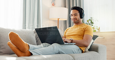 Buy stock photo Relax, headphones and laptop with man on sofa for streaming service, film website and comfortable. Movie subscription, watching series and entertainment with person in living room of home for search