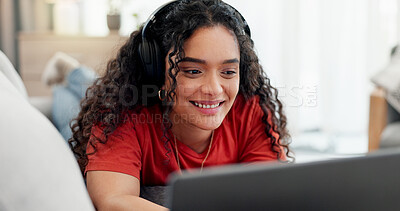 Buy stock photo Woman, laptop and headphones on sofa for movie, social media and video streaming or website in home. Relax, internet audio and female person on couch with technology, break and watching film on app