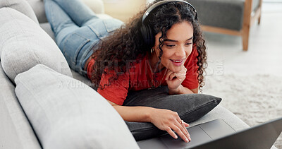 Buy stock photo Peace, headphones and laptop with woman on sofa for streaming service, film website or comfortable. Movie subscription, watching series and entertainment with person in living room of home for search
