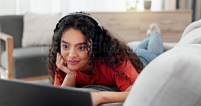 Buy stock photo Headphones, laptop and streaming with woman on sofa in living room of home for online subscription. Computer, relax and watching video with person in apartment for break, entertainment or media
