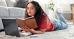 Woman, student and reading notebook at house for education, study notes and planning course. Female person, laptop and journal for learning, research and scholarship reminder with university schedule