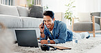 Phone call, remote work and man on carpet, laptop and smile with communication, email and contact. Person, smartphone and freelancer on ground, home or conversation with positive feedback or internet