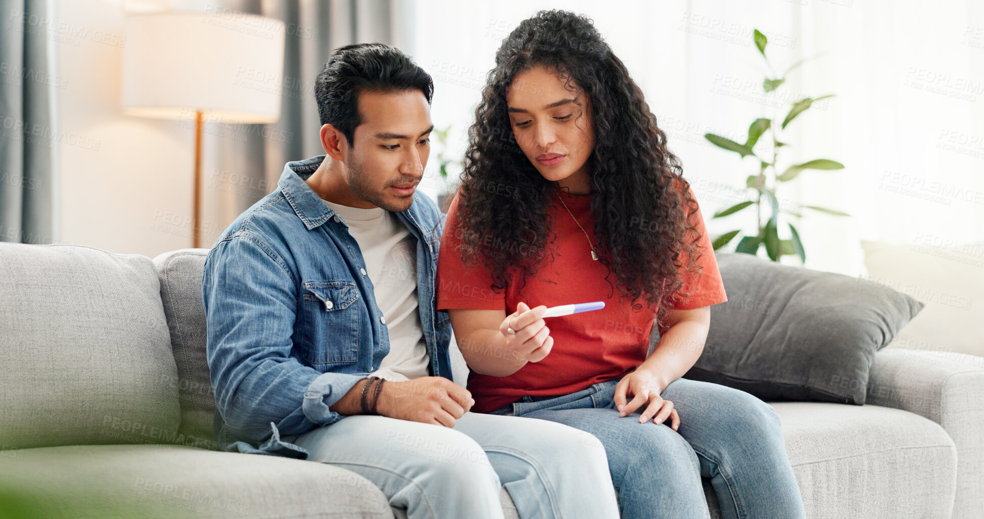 Buy stock photo Pregnancy test, home and couple waiting on sofa unsure for fertility doubt, results and parenting news. Relationship, pregnant and man with woman with medical kit for ivf treatment or ovulation