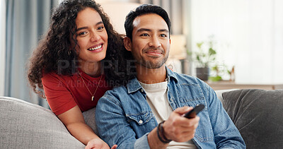 Buy stock photo Man, woman and watching tv on sofa with remote, click and choice for movies, streaming or series in home. Happy couple, relax and television with care, bonding and love for film subscription at house