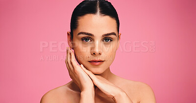 Buy stock photo Skincare, beauty and portrait of woman in studio with natural, cosmetics or facial glow. Serious, mockup space and female person from Brazil with face dermatology for wellness by pink background.