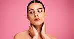 Woman, thinking and beauty with touch in studio, results and natural makeup for glow on pink background. Girl, model and happy with reflection, mockup space and cosmetics for facial transformation