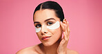 Portrait, woman and eye mask for skincare in studio for dark circle, reduce puffiness and hydration. Person, facial patches and mockup space for beauty, collagen benefits and shine on pink background