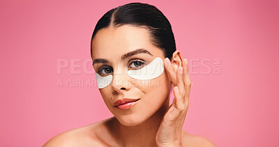Buy stock photo Portrait, woman and eye mask for skincare in studio for dark circle, reduce puffiness and hydration. Person, facial patches and mockup space for beauty, collagen benefits and shine on pink background
