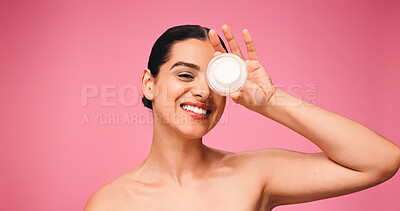 Buy stock photo Woman, portrait and skincare cream in studio, smile and pride with collagen on pink background. Girl, model and happy with lotion, mockup space and natural cosmetics product for beauty in Portugal