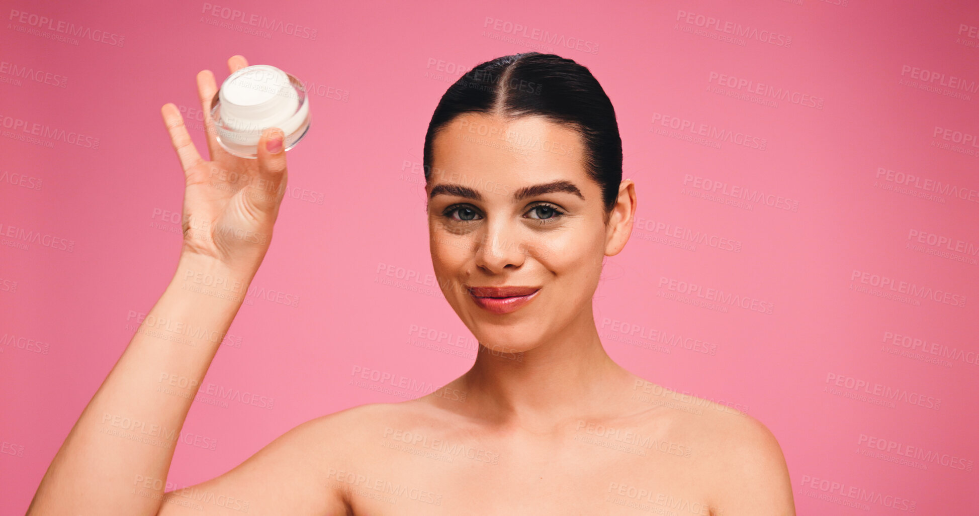Buy stock photo Beauty, moisturizer and portrait of woman in studio with natural, cosmetics or facial glow. Face cream, skincare and female person from Brazil with dermatology for wellness by pink background.