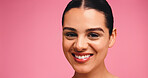 Woman, portrait and skincare with smile in studio, results and natural makeup with glow on pink background. Girl, model and happy with confidence, mockup space and cosmetics for beauty in Portugal