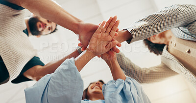 Buy stock photo Hands, stack and team at office with low angle, support or synergy with goals in circle at startup. People, group and huddle at workplace for celebration, success or collaboration at creative agency