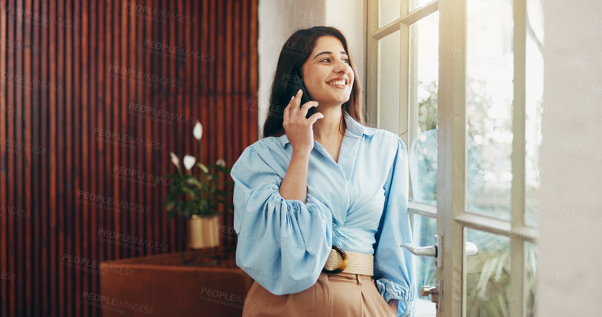 Buy stock photo Phone call, window and business woman in office for communication, contact and online chat. Startup, creative company and person on smartphone for connection, discussion or networking for client deal