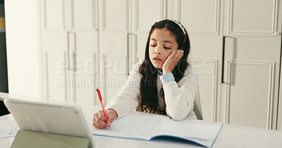 Buy stock photo Girl, child and writing with homework, thinking and tablet for e learning, maths and ADHD with app in home. Kid, pupil and bored for study with online course, development or education at house