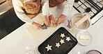 Baking, cookies and hands of people in kitchen together for ingredients or recipe from above. Cooking, process and tray with family in apartment for learning how to bake or prepare pastry biscuits