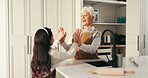 Happy grandma, grandchild and high five in kitchen for baking success or dessert recipe in home. Grandmother, grandkid and smile with help or apron for fun cooking, bonding or learning together