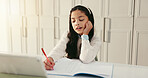 Girl, child and writing with homework, book and tablet for e learning, maths and problem solving for quiz. Kid, pupil and notes with solution for online course, development and education at house