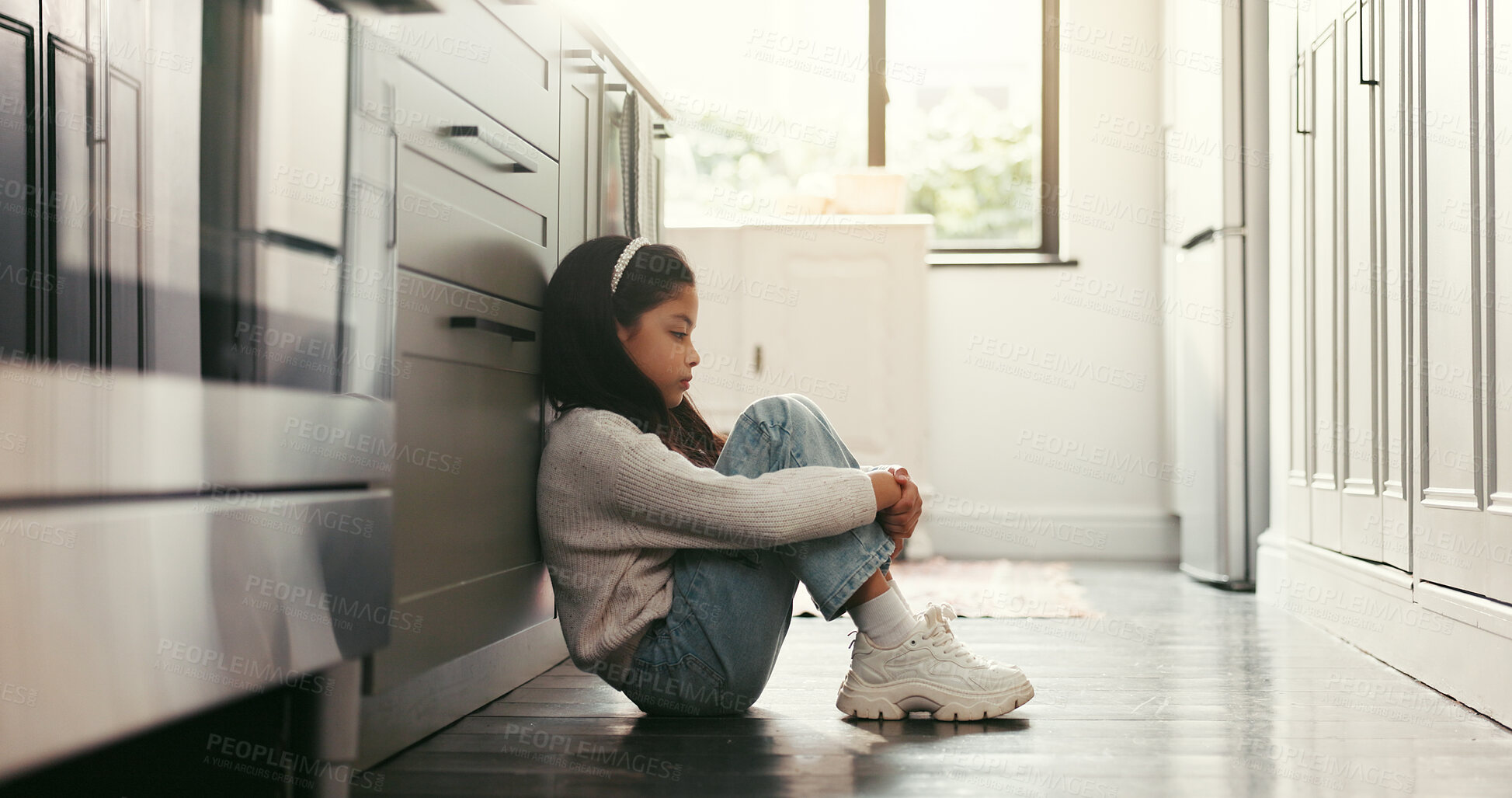 Buy stock photo Sad girl, child and thinking in home with stress, trauma and abuse victim on kitchen floor. House, depression and unhappy kid with reflection for loneliness, anxiety and mental health challenge