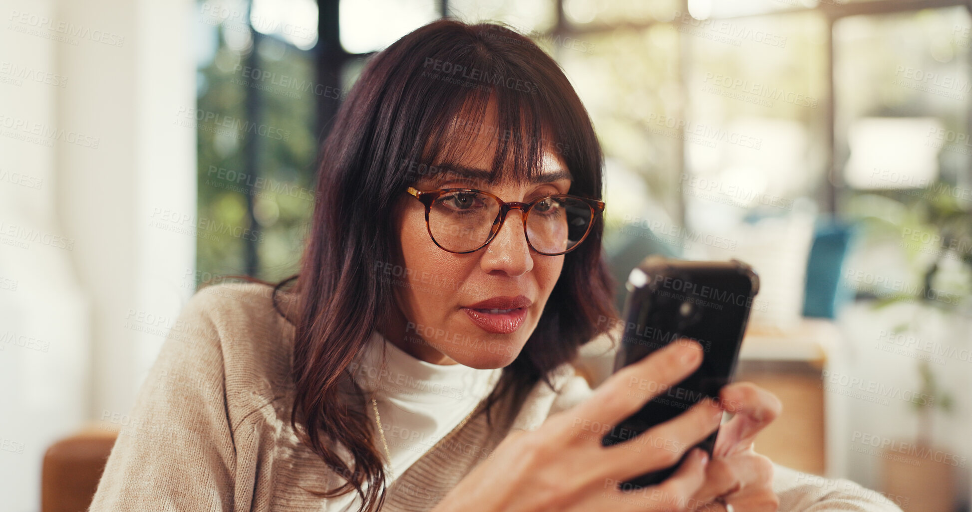 Buy stock photo Home, woman and concerned with smartphone for scam or cybercrime on fake website. Mature person, sofa and annoyed at living room with internet or online fraud and hacking of social media profile