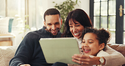 Buy stock photo Parents, girl and happy with tablet on sofa, laugh or love with funny film, bonding and streaming in lounge. Father, mother and daughter with joke, app and movies on couch at interracial family house