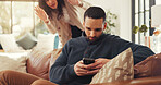 Man, phone and cheating on sofa with woman, sneaking or surveillance for texting, chat or online dating. Person, smartphone and affair on web, social media or infidelity with partner by couch in home