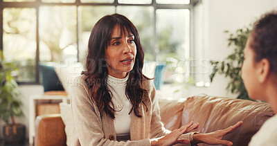 Buy stock photo Talking, home and mom with child on sofa for conversation, discussion and chat for bonding together. Family, love and mother with girl in living room for care, communication and healthy relationship