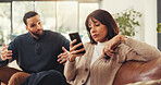 Woman, phone and ignore man on couch with social media addiction, talk and gesture for attention. Person, couple and smartphone with texting, game or web chat with mobile app in lounge at apartment