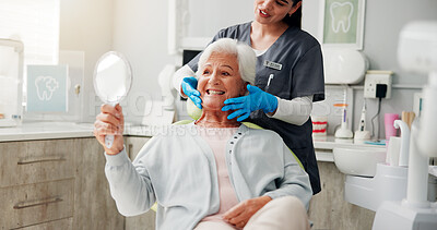 Buy stock photo Dentist, senior woman and mirror with results for teeth whitening, dental implant or oral care. Retirement, healthcare and doctor with happy old patient in clinic for dentures or root canal treatment