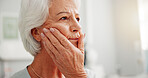 Toothache, thinking and senior woman in home with hand on face for cavity or swollen gums. Memory, mouth inflammation and elderly female person in retirement with pressure for teeth pain in apartment