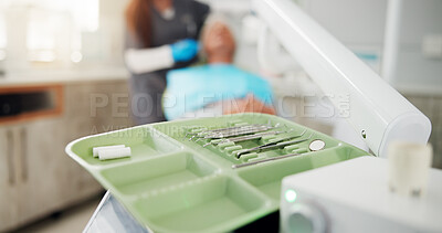 Buy stock photo Dental, procedure and tools on tray in office for appointment, oral care or hygiene closeup. Assessment, checkup or consulting with dentist and patient in clinic for cleaning or teeth whitening