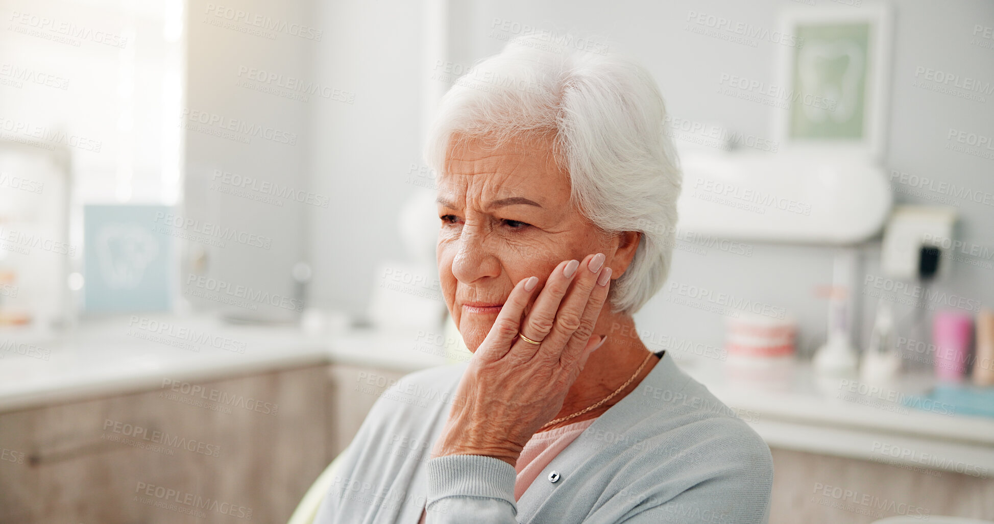 Buy stock photo Toothache, thinking and senior woman at dentist with hand on face for cavity or swollen gums. Memory, mouth inflammation and elderly person in retirement with pressure for teeth pain at dental clinic