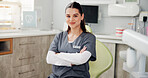 Arms crossed, portrait and smile of woman dentist in office for hygiene, oral care or teeth whitening. Appointment, healthcare and welcome with friendly dental professional in clinic for consultation
