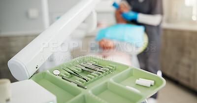 Buy stock photo Checkup, dental and tools on tray in office for appointment, oral care or hygiene closeup. Assessment, consulting or procedure with dentist and patient in clinic for cleaning or teeth whitening
