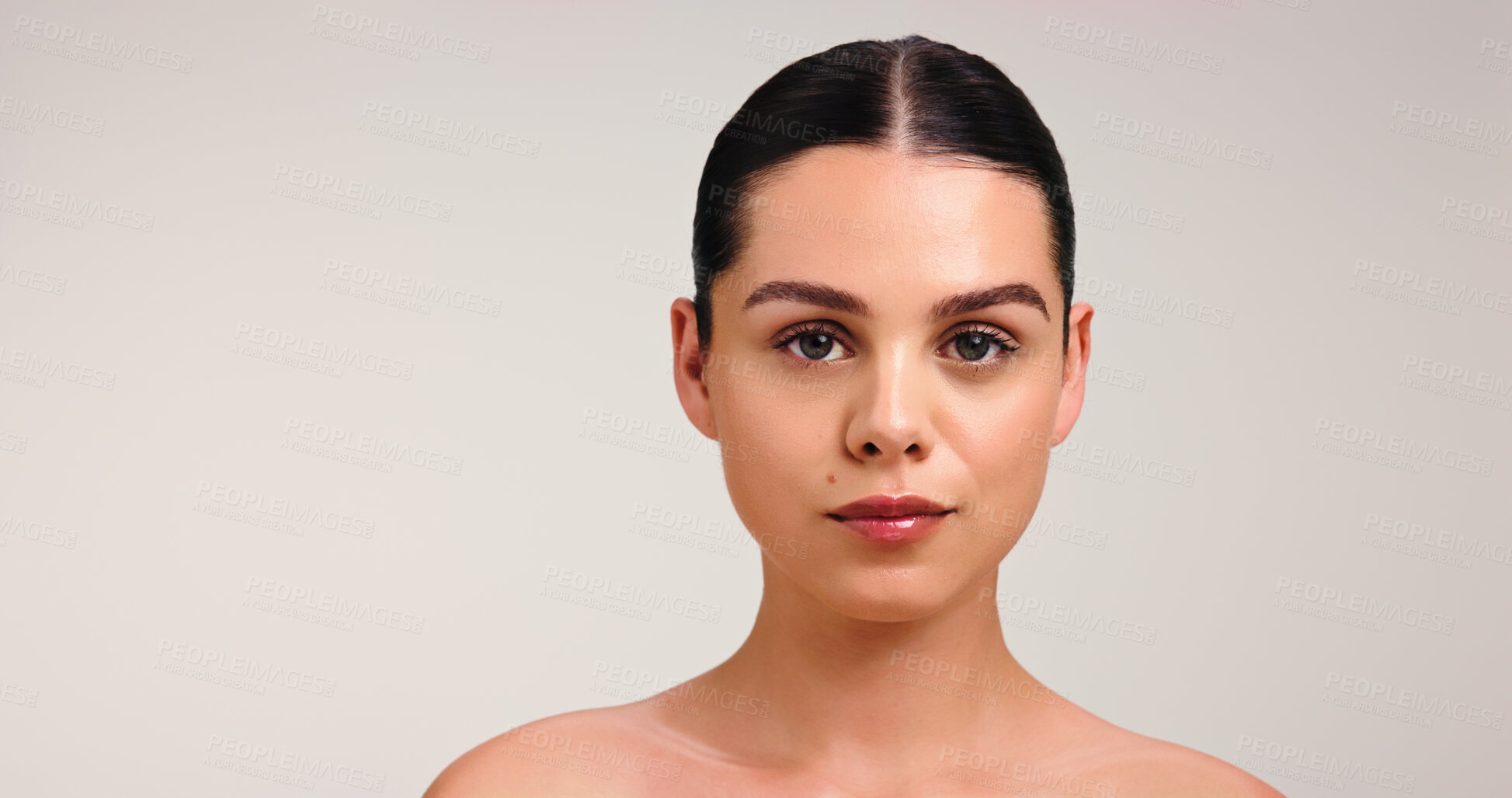 Buy stock photo Portrait, woman and skincare for glow in studio, mockup space and pride for healthy skin or serious. White background, hydration and person with soft face, wellness and natural cosmetics in Canada