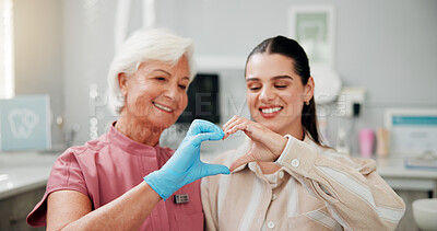 Buy stock photo Woman, dentist and heart hands at clinic, happy and gratitude with good service for oral care. Mature person, orthodontist and patient with love emoji, sign or smile with dental health at hospital