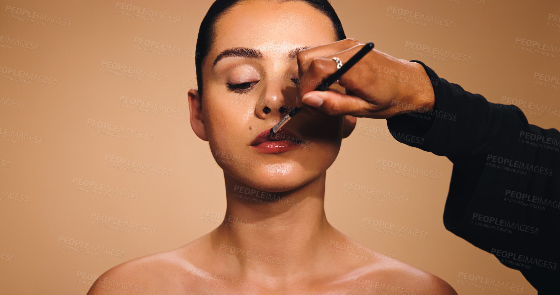 Buy stock photo Beauty, hand and woman with lipstick brush, makeup artist and cosmetics for facial shine. Space, glowing skincare and person with tool, lip gloss application and color product on studio background